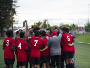 The Fort Vancouver boys soccer team celebrates clinching a state berth after a 2-0 win over Ridgefield in a 2A district playoff at Fort Vancouver on Saturday, May 14, 2022.