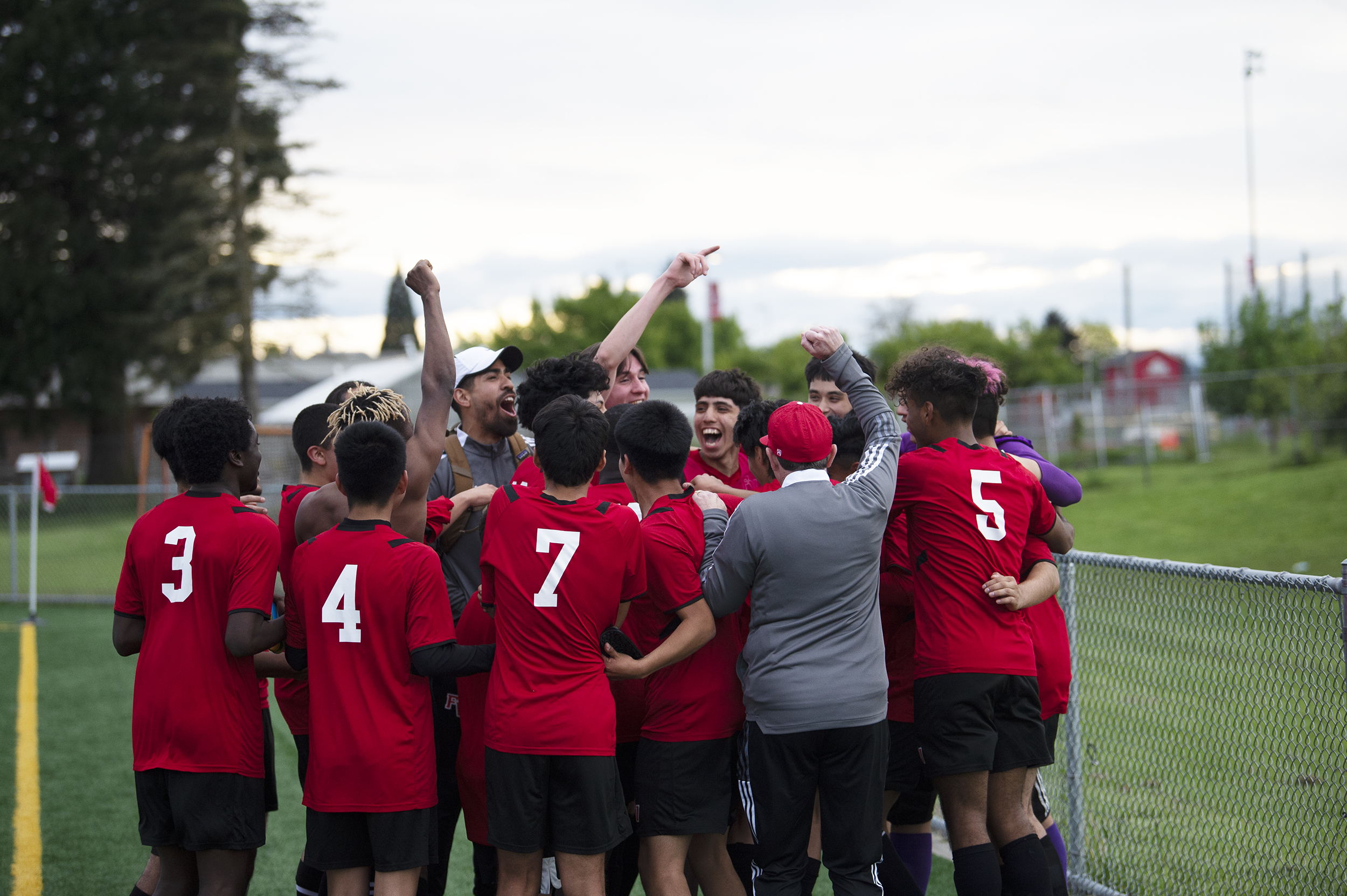 The Fort Vancouver boys soccer team celebrates clinching a state berth after a 2-0 win over Ridgefield in a 2A district playoff at Fort Vancouver on Saturday, May 14, 2022.