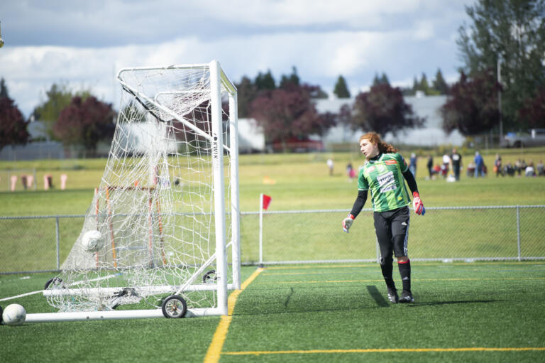 Elma goalkeeper Andy Salvatierra watches the ball hit the back of the net on a goal by David Moore during Seton Catholic's 3-0 win over Elma in the 1A boys soccer district championship game on Saturday, May 14, 2022.