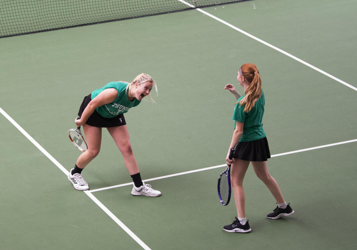 Mountain View's Ari Haygood (left) and Lexi Frost celebrate after winning the girls doubles final at the 3A district tennis tournament at Club Green Meadows on Saturday, May 14, 2022.