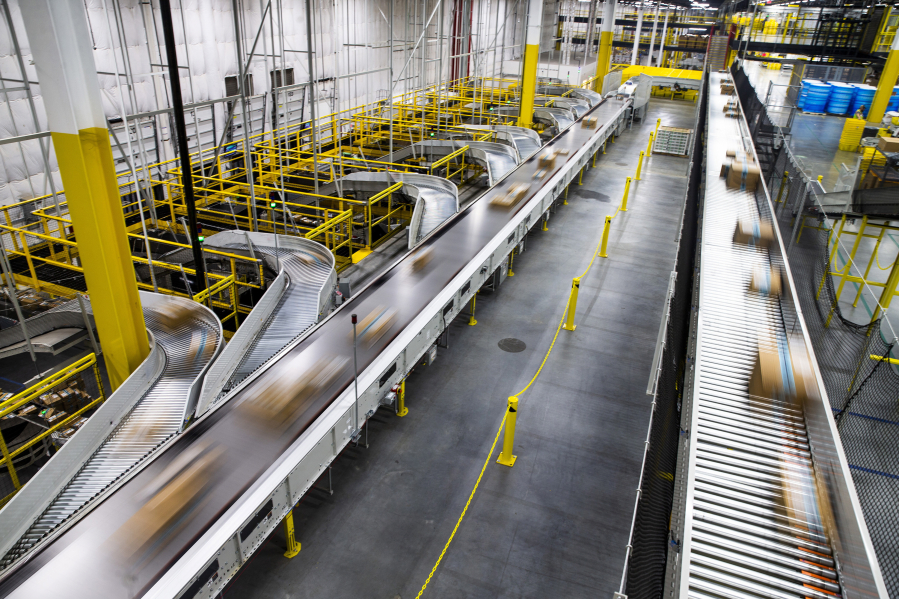 Packages move on a conveyor belt to be shipped at an Amazon fulfillment center in Grapevine, Texas, on December 5, 2018.