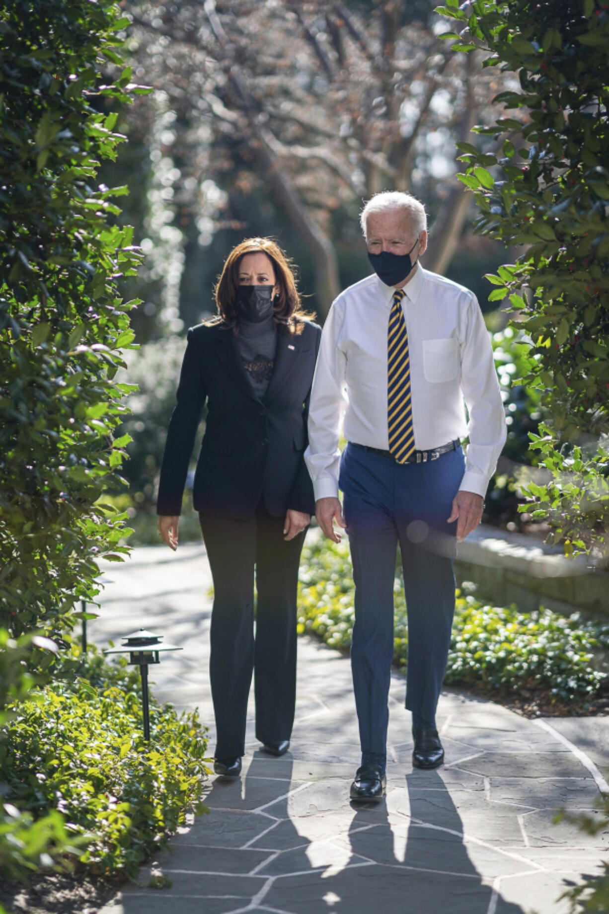 President Joe Biden walks with Vice President Kamala Harris through the grounds of the White House following their first weekly lunch Jan. 22, 2021, in Washington, D.C.