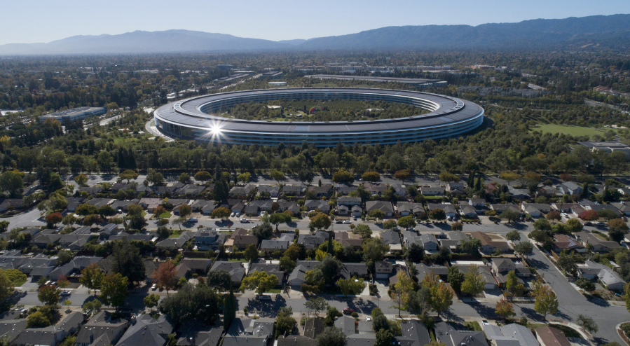 Apple repeatedly has postponed its plans to bring employees back for three days a week. Apple Park's spaceship campus is seen from this drone view in Sunnyvale, California.