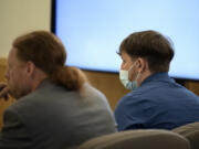 Defense attorney Shon Bogar, left, joins defendant Zachery Hansen during his attempted murder trial at the Clark County Courthouse on Monday morning. Hansen was accused of loosening the lug nuts on his former partner's tires while she had their 4-year-old daughter in the car. On Tuesday, the judge acquitted Hansen of two counts each of second-degree attempted murder and first-degree attempted assault but found him guilty of two counts of second-degree attempted assault.