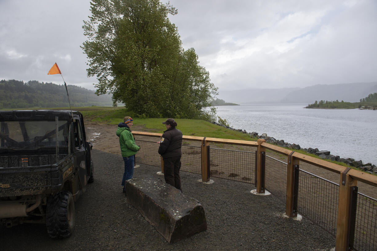 Jasmine Zimmer-Stucky of the Lower Columbia Estuary Partnership, left, chats with Juliette Fernandez of the U.S. Fish and Wildlife Service as they check out a view of the Columbia River from a new viewpoint at Steigerwald Lake National Wildlife Refuge on Monday afternoon. The refuge reopened to the public on May 1.
