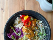River Maiden's Amaze Bowl combines rice, white beans, cilantro garlic sauce, avocado, pickled cabbage, sliced sweet peppers, sweet potato, red pepper pesto and toasted seeds. The bowl also features micro greens from Red Truck Farm.