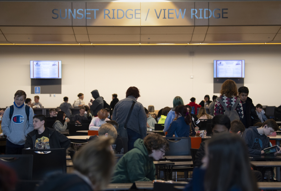 Students gather in the cafeteria at View Ridge Middle School before school on May 4. Among the plans to alleviate overcrowding in Ridgefield schools would be the conversions of two extracurricular spaces at View Ridge -- the wrestling room and the Black Box Theatre -- into multiple new classroom spaces.