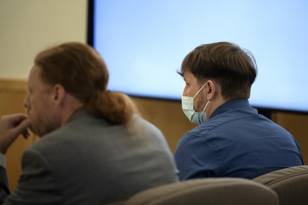 Defense attorney Shon Bogar, left, joins defendant Zachery Hansen during his attempted murder trial Monday morning at the Clark County Courthouse. Hansen is accused of loosening the lug nuts on his former partner's tires while she had their 4 -year-old daughter in the car.