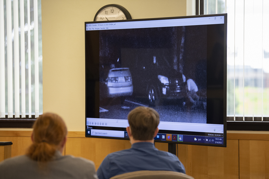 Defense attorney Shon Bogar, left, joins defendant Zachery Hansen as they watch surveillance video during his attempted murder trial Monday morning at the Clark County Courthouse. Hansen is charged with two counts of second-degree attempted murder and two counts of first-degree attempted assault.