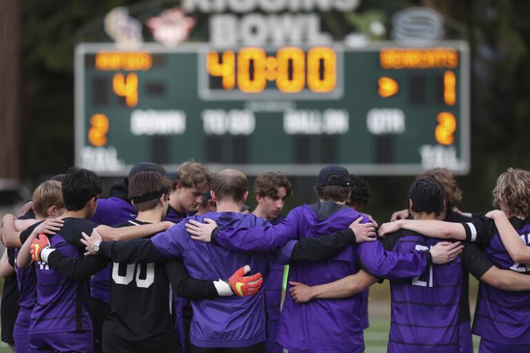 Columbia River boys soccer team huddles at the beginning of the second half leading 4-1 against WF West in the first round of the Class 2A state playoffs.