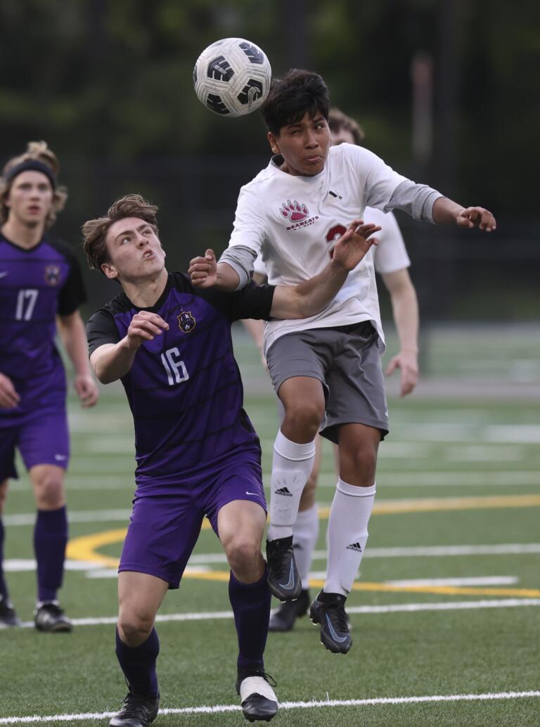 Columbia River's Elliot McClafferty, left, and WF West's Adrian Jaimes, right, battle for the ball in the first round of the Class 2A state playoffs.