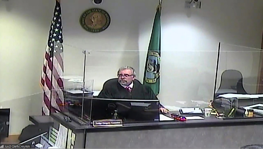 Judge Gregory Gonzales presides Wednesday over Clark County Juvenile Court. Adolfo Cruz Torres, 15, of Vancouver appeared on suspicion of second-degree murder, second-degree unlawful possession of a firearm and alteration of identifying marks on a firearm.