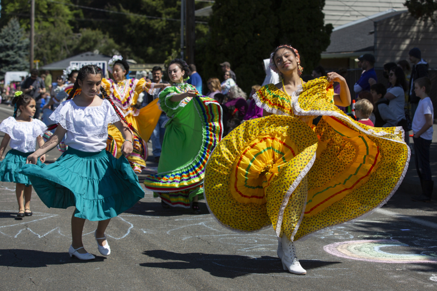 A group of dancers with a Mexico float perform Saturday in the Hazel Dell Parade of Band. The festivities included marching bands, equestrian entries, political campaigns and many more.