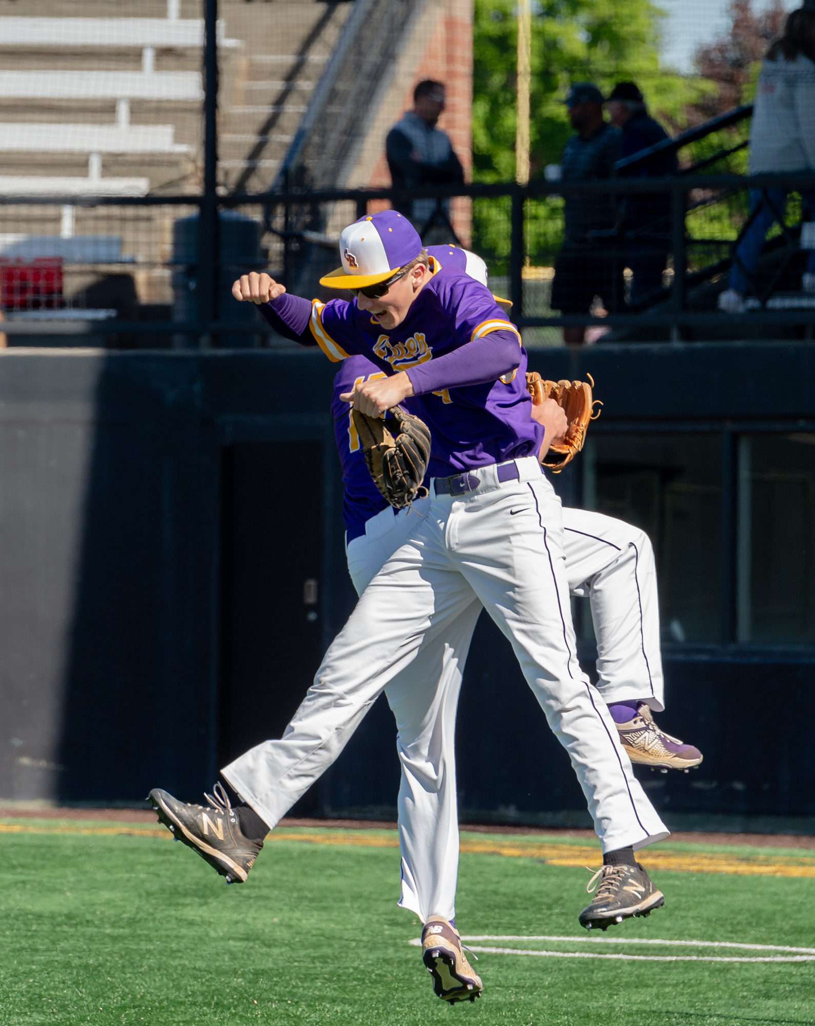 Columbia River's Casey Struckmeier and Peter Lubisich hip bump before a 2A State Baseball game on Saturday, May 21, 2022, at Propstra Stadium. Columbia River won 4-1.