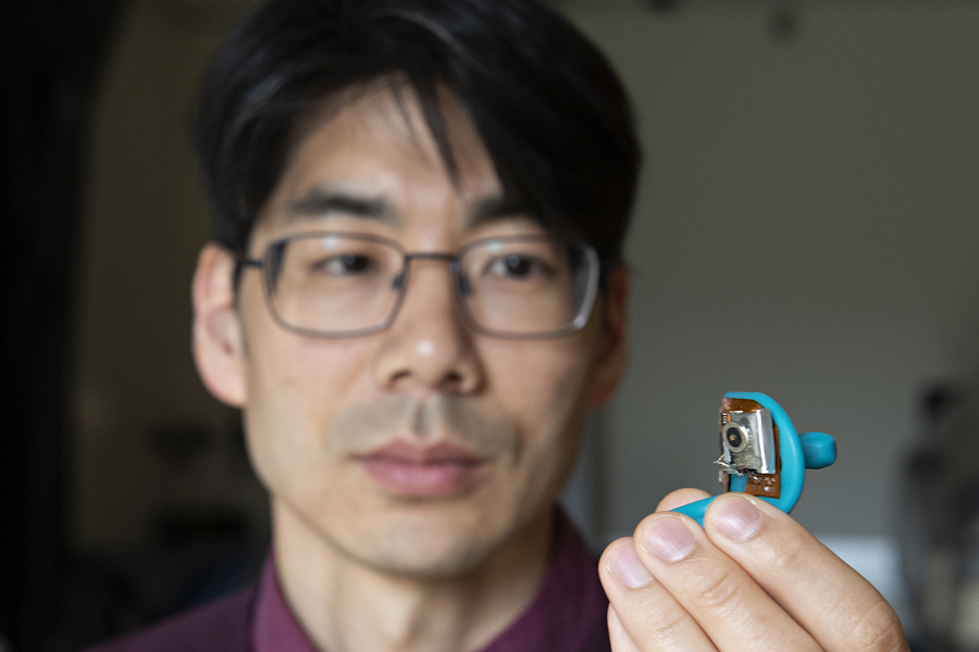 Jong-Hoon Kim, an associate professor at WSU Vancouver, holds a "smart pacifier," he helped develop. The device is used to monitor babies' electrolytes in Newborn Intensive Care Units, and it could potentially eliminate the need for an invasive, twice-daily blood draw normally performed to monitor babies' electrolytes, potassium and hydration levels.