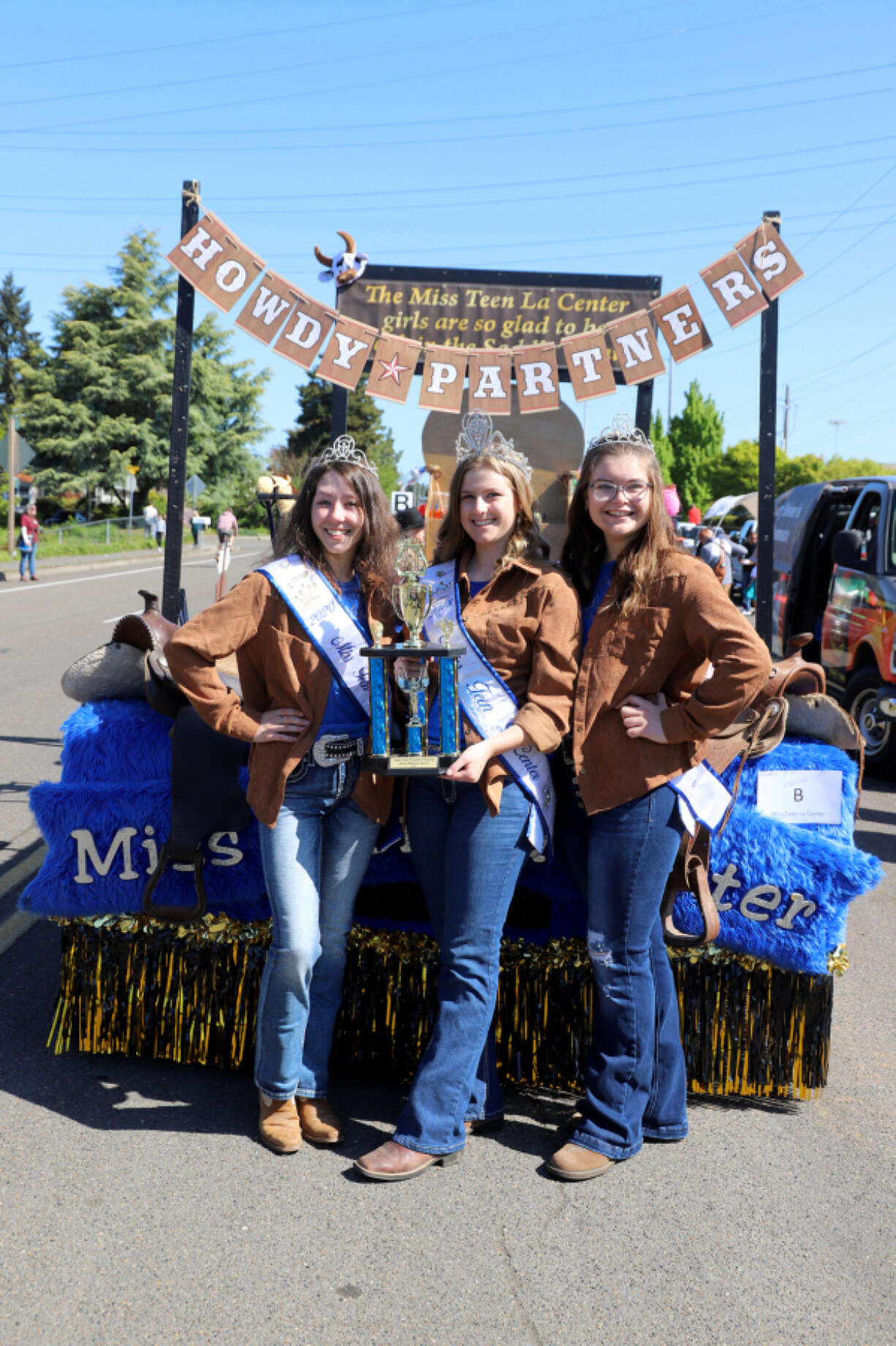 The Miss Teen La Center court was glad to be "Back in the Saddle Again" at the Hazel Dell Parade of Bands.