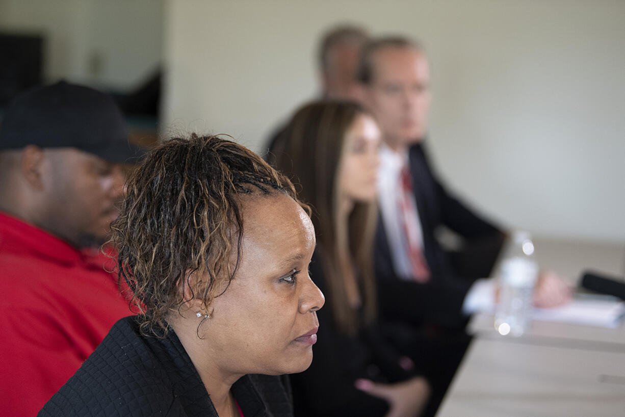 Tammi Bell, foreground, mother of Kevin Peterson Jr., joins family members during a press conference as they announce a lawsuit against the Clark County Sheriff's office after the 21-year-old Black man was shot in 2020, as seen at the Aero Club on Thursday afternoon, May 26, 2022.