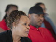 Tammi Bell, foreground, mother of Kevin Peterson Jr., joins his father, Kevin Peterson Sr., and other family members during a press conference as they announce a lawsuit against the Clark County Sheriff's Office after the 21-year-old Black man was shot in 2020, as seen at the Aero Club on Thursday afternoon, May 26, 2022.
