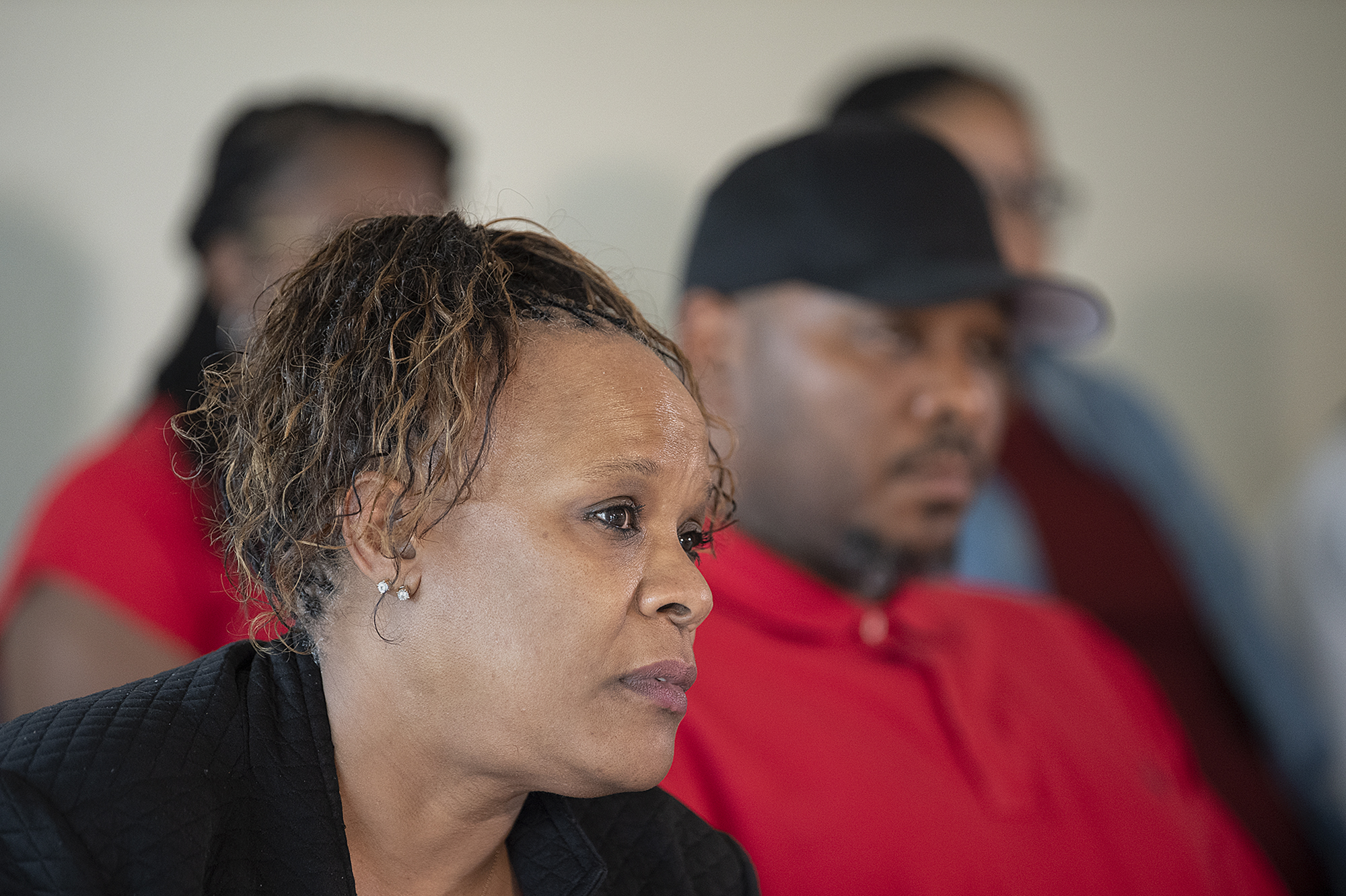 Tammi Bell, foreground, mother of Kevin Peterson Jr., joins his father, Kevin Peterson Sr., and other family members during a press conference as they announce a lawsuit against the Clark County Sheriff's Office after the 21-year-old Black man was shot in 2020, as seen at the Aero Club on Thursday afternoon, May 26, 2022.