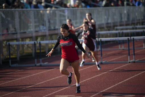 Columbia-White Salmon's Chanele Reyes wins the 100-meter hurdles at the Class 1A District 4 track and field meet at Seton Catholic on Thursday, May 19, 2022. (Tim Martinez/The Columbian)