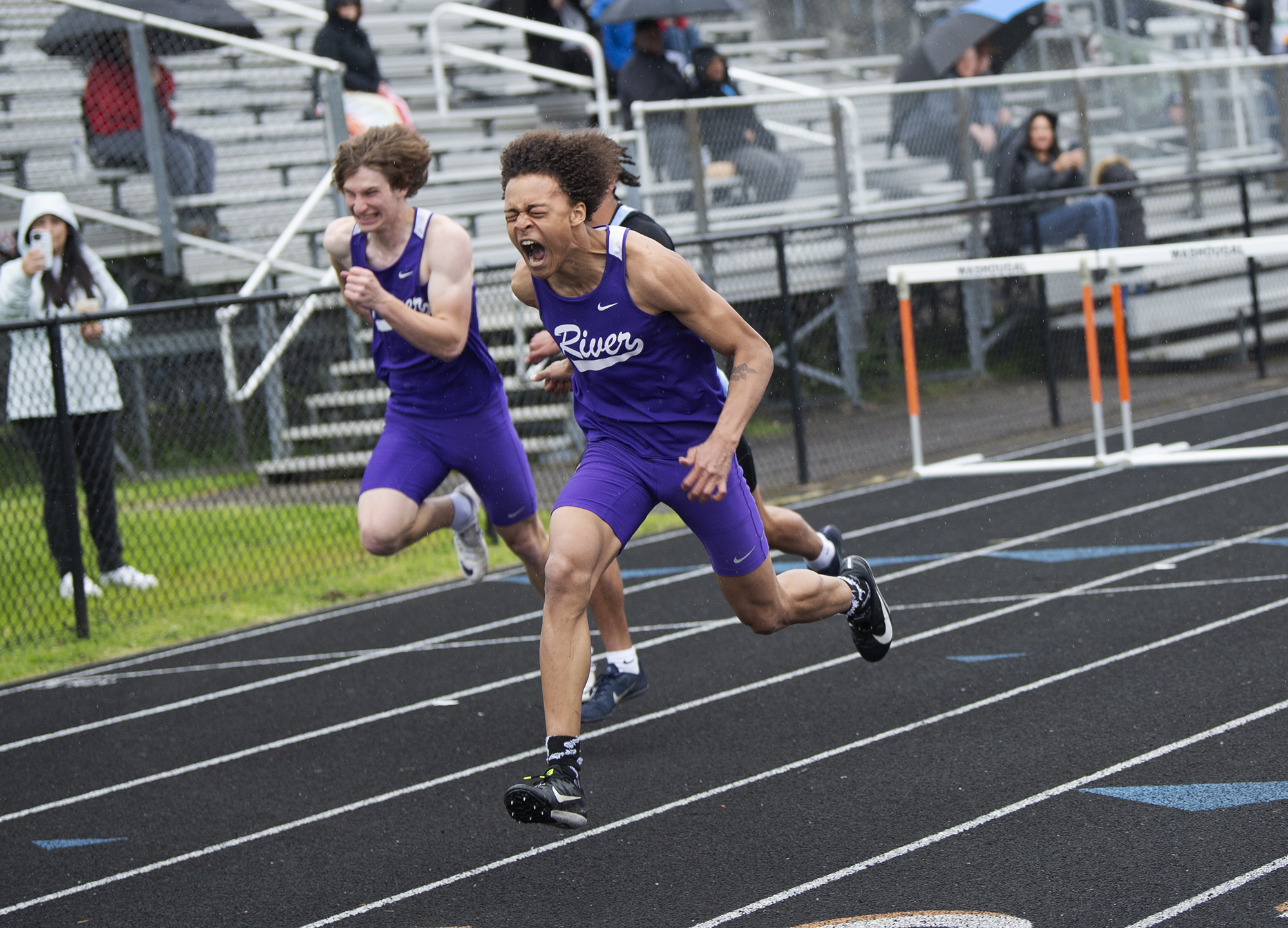 Columbia River's Dakari Richmond screams out as he pushes for the finish line to win the boys 110-meter hurdles at the 2A sub-district track and field meet at Washougal High School on May 13, 2022.