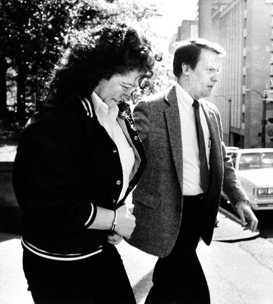 Stella Nickell is taken from the federal courthouse in Seattle May 9, 1988 by U.S. Marshall Jerry Moore. She was convicted Monday in Seattle of causing the deaths of her husband and another woman by lacing their Extra-Strength Excedrin with cyanide.