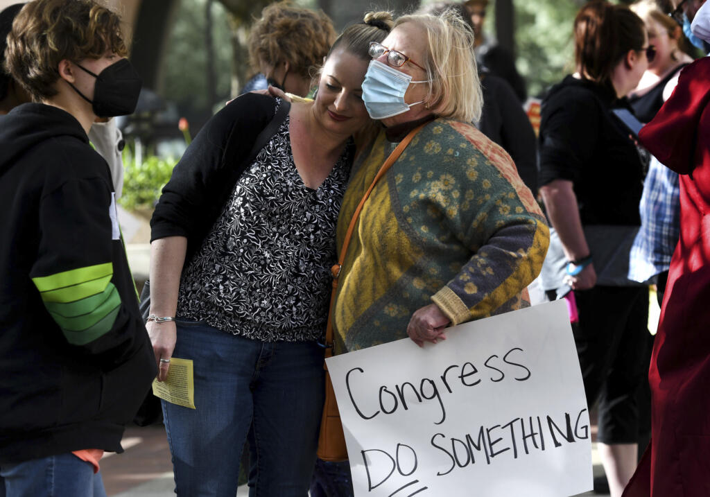 Aileen Luppert, left, gets a hug from her Aunt Eve Luppert during the Planned Parenthood abortion-rights rally in front of the Federal Courthouse in Spokane, Wash., on Tuesday, May 3, 2022.
