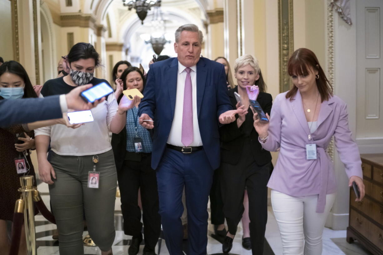 House Minority Leader Kevin McCarthy, R-Calif., heads to his office surrounded by reporters after House investigators issued a subpoena to McCarthy and four other GOP lawmakers as part of their probe into the violent Jan. 6 insurrection, at the Capitol in Washington, Thursday, May 12, 2022. The House Select Committee on the January 6 Attack has been investigating McCarthy's conversations with then-President Donald Trump the day of the attack and meetings that the four other lawmakers had with the White House as Trump and his aides conspired how to overturn his defeat. (AP Photo/J.