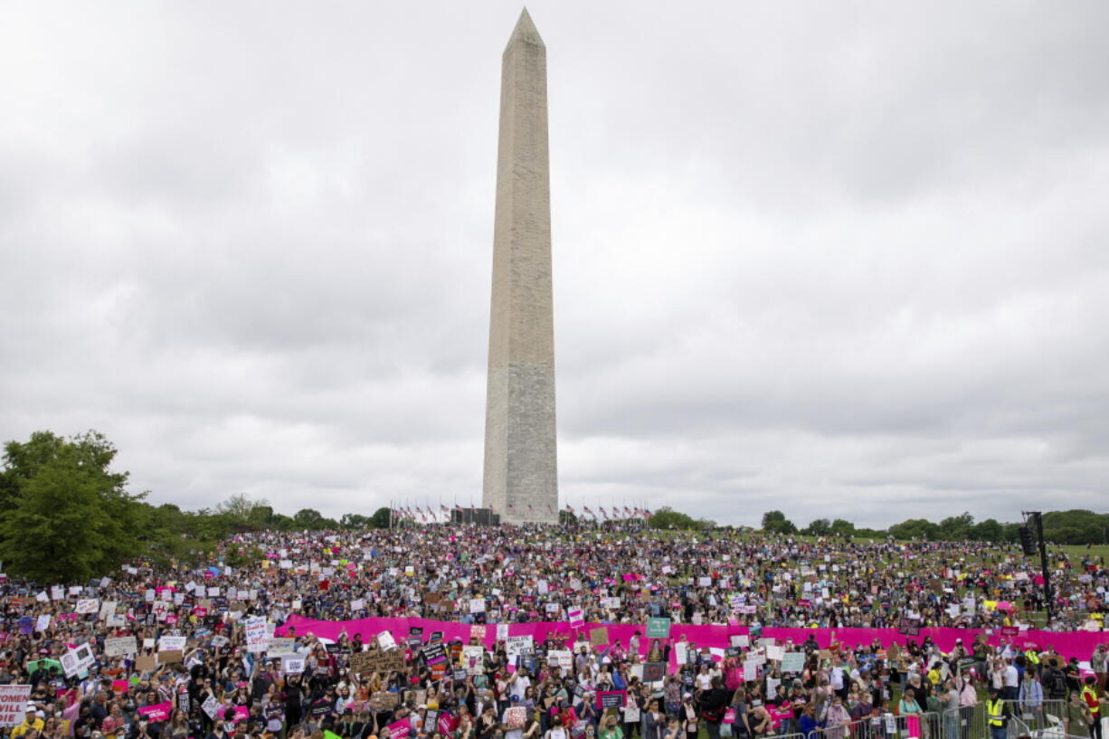 Abortion rights demonstrators rally, Saturday, May 14, 2022, on the National Mall in Washington, during protests across the country.