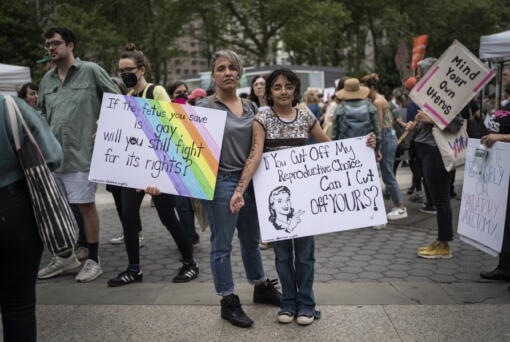 Amnet Ramos, 44, and her daughter, Inaia Hernandez, 12, stand for a portrait during a protest in Manhattan on Saturday, May 14, 2022, in New York where generations of women came together for a protest against the U.S. Supreme Court's anticipated ruling overturning Roe v. Wade. Ramos has protested since the Trump administration, and the threat to abortion rights has steeled her resolve to be heard - and that of her daughter.