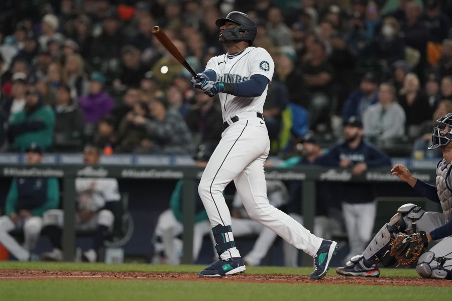 Seattle Mariners' Kyle Lewis watches his a solo home run against the Houston Astros during the second inning of a baseball game, Saturday, May 28, 2022, in Seattle. (AP Photo/Ted S.