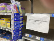 A sign telling consumers of limits on the purchase of baby formula hangs on the edge of an empty shelf for the product in a King Soopers grocery store, Wednesday, May 11, 2022, in southeast Denver. Parents across the country are struggling to find baby formula in stock in stores because of supply chain disruptions combined with a massive safety recall.