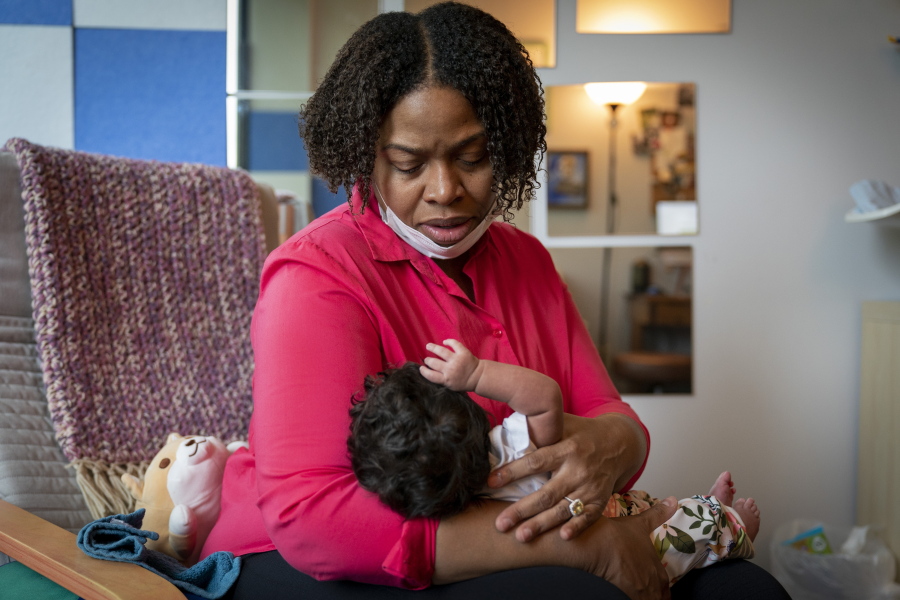 Capri Isidoro, of Ellicott City, Md., looks at her one-month-old baby Charlotte, Monday, May 23, 2022, in Columbia, Md., during a lactation consultation. Charlotte was delivered via emergency c-section and given formula by hospital staff. Isidoro has been having trouble with breastfeeding and has been searching for a formula that her daughter can tolerate well. "If all things were equal I would feed her with formula and breastmilk," says Isidoro, "but the formula shortage is so scary.