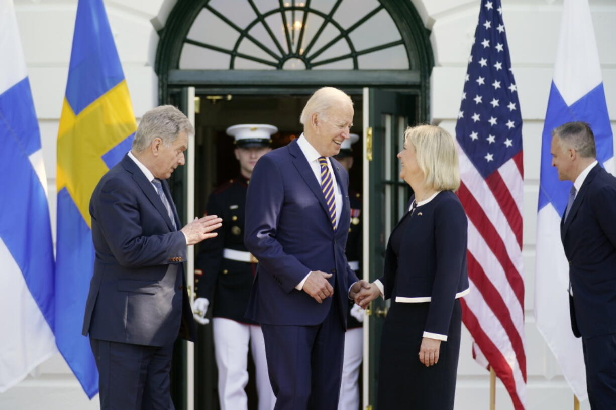 President Joe Biden greets Prime Minister Magdalena Andersson of Sweden and President Sauli Niinisto of Finland as they arrive at the White House in Washington, Thursday, May 19, 2022.