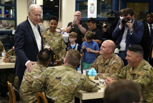 U.S. President Joe Biden, left, meets with American service members and their family at Osan Air Base, Sunday, May 22, 2022, in Pyeongtaek, South Korea.