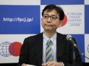 Noriyuki Shikata, cabinet secretary for public affairs of Kishida's government, gets introduced before he speaks in a news briefing in Tokyo, Friday, May 20, 2022. Japan welcomes the Indo-Pacific Economic Framework (IPEF), a new U.S. economic initiative for the Indo-Pacific region that President Biden is expected to roll out during his Tokyo visit next week. Shikata said IPEF is expected to focus more about supply chains, clean energy, worker standards and anti-corruption programs rather than issues in traditional trade agreements such as market access and tariffs.