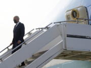President Joe Biden exits Air Force One as he arrives at Osan Air Base, Friday, May 20, 2022, in Pyeongtaek, South Korea.