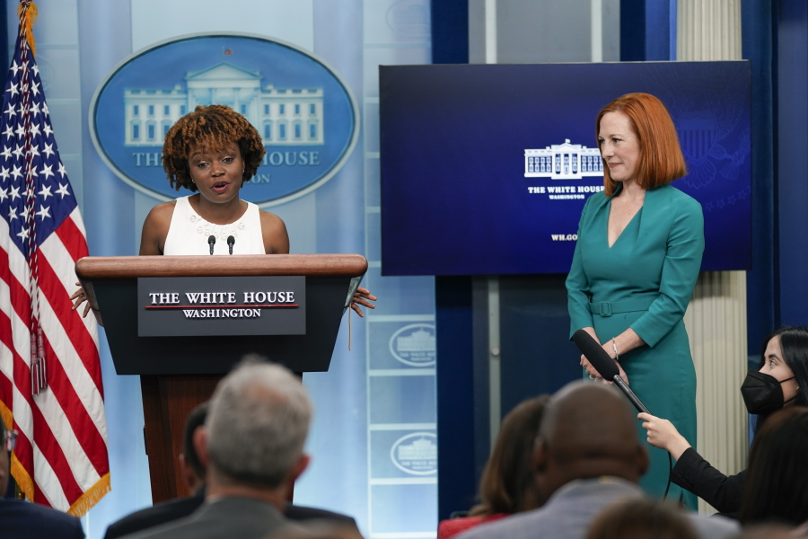 White House press secretary Jen Psaki, right, listens as incoming press secretary Karine Jean-Pierre speaks during a press briefing at the White House, Thursday, May 5, 2022, in Washington.