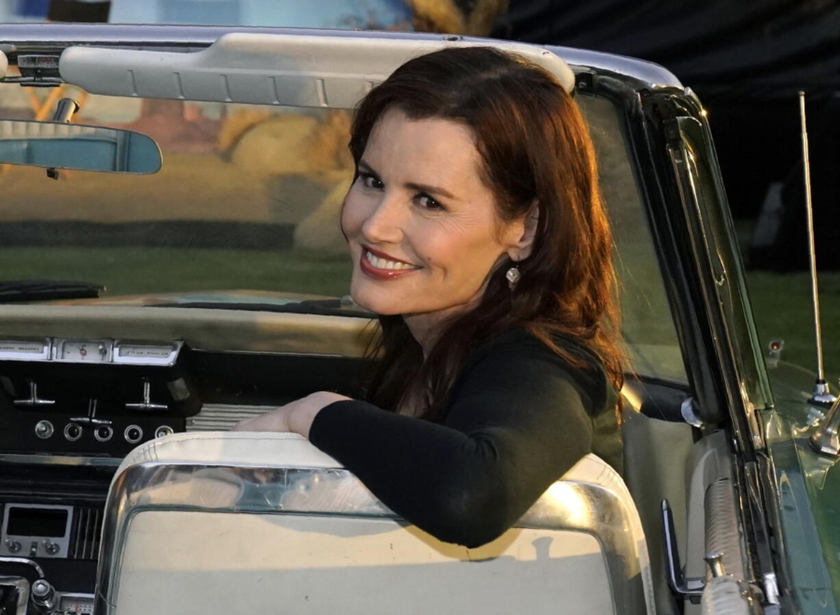 FILE - Geena Davis, star of "Thelma & Louise," poses in a 1966 Ford Thunderbird similar to the one featured in the film, at the 30th anniversary screening of the film in Los Angeles on June 18, 2021. Davis has a memoir coming out this fall, titled "Dying of Politeness." HarperOne, an imprint of HarperCollins Publishers, announced Tuesday that the book will be published Oct. 11.