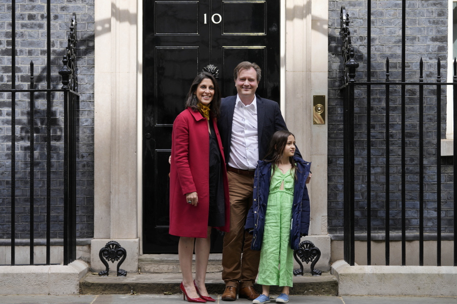 Nazanin Zaghari-Ratcliffe poses for a picture with with her husband Richard Ratcliffe and their daughter Gabriella at 10 Downing Street before they meet Britain's Prime Minister Boris Johnson in London, Friday, May 13, 2022.