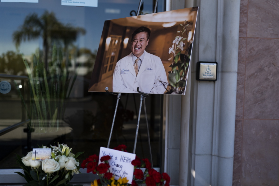 A photo of Dr. John Cheng, a 52-year-old victim who was killed in Sunday's shooting at Geneva Presbyterian Church, is displayed outside his office in Aliso Viejo, Calif., Monday, May 16, 2022. Authorities say a Chinese-born gunman was motivated by hatred against Taiwan when he chained shut the doors of the church and hid firebombs before shooting at a gathering of mainly of elderly Taiwanese parishioners. (AP Photo/Jae C.