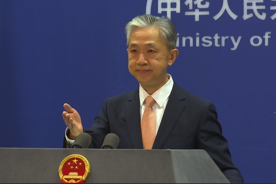 Chinese Foreign Ministry spokesperson Wang Wenbin reacts during the daily presser at the Ministry of Foreign Affiairs in Beijing, Friday, May 27, 2022. China on Friday criticized a speech by U.S. Secretary of State Antony Blinken focused on relations between the world's top two economic powers, saying the U.S. was seeking to smear Beijing's reputation.