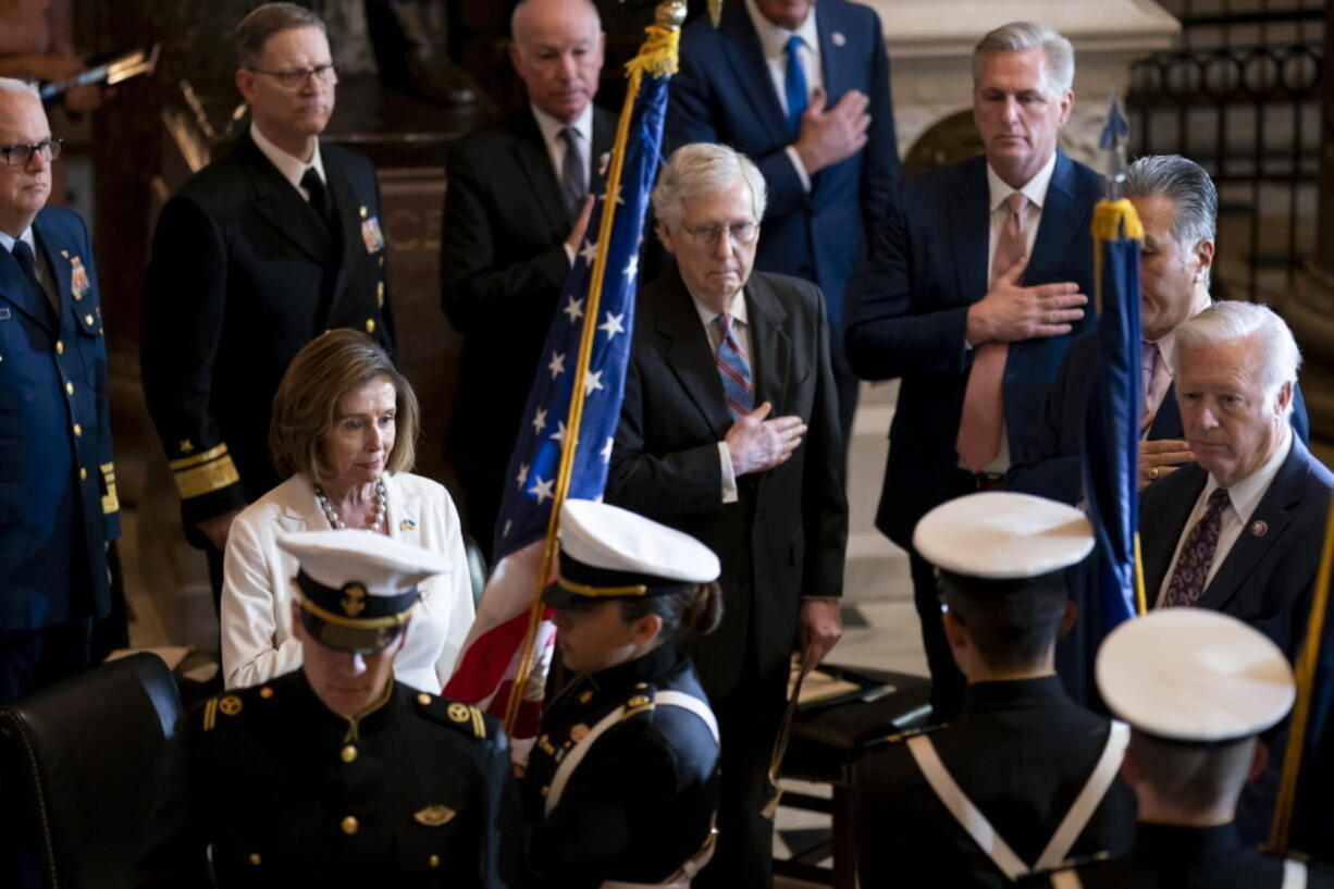 Speaker of the House Nancy Pelosi, D-Calif., Senate Minority Leader Mitch McConnell, R-Ky., and House Minority Leader Kevin McCarthy, R-Calif., stand together as they attend a Congressional Gold Medal ceremony to honor members of the Merchant Marine who served in World War II, at the Capitol in Washington, Wednesday, May 18, 2022. (AP Photo/J.