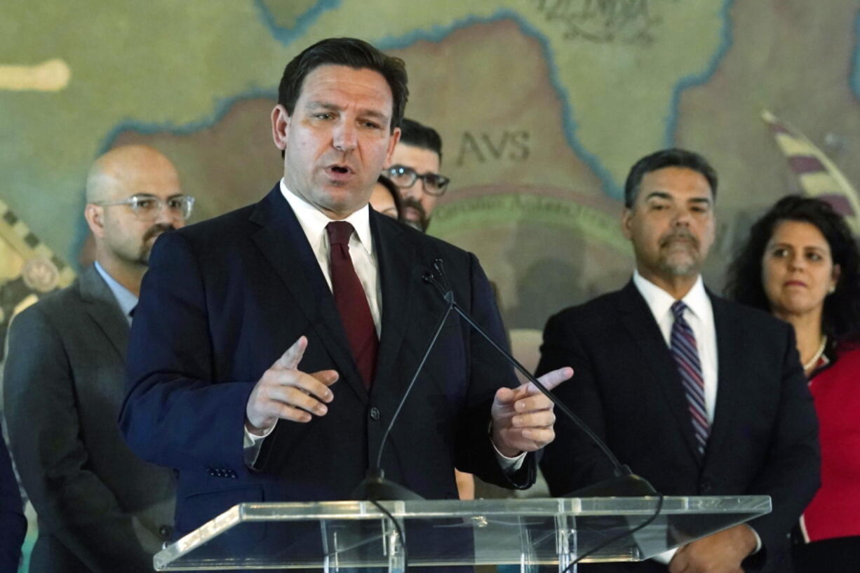 FILE - Florida Gov. Ron DeSantis speaks at Miami's Freedom Tower, on Monday, May 9, 2022, in Miami. A congressional map approved by DeSantis and drawn by his staff is unconstitutional because it breaks up a district where Black voters can choose their representatives, a state judge said Wednesday, May 11, 2022.