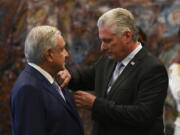 Mexican President Andr?s Manuel L?pez Obrador is decorated by his Cuban counterpart Miguel Diaz Canel with the Jose Marti order at Revolution Palace in Havana, Cuba, Sunday, May 8, 2022.