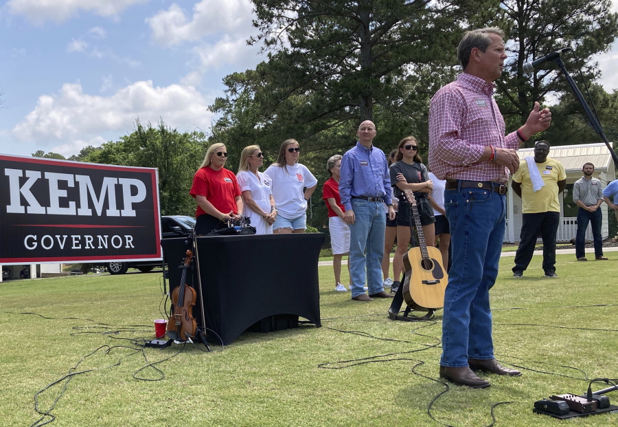 Georgia Gov. Brian Kemp speaks at a get-out-the-vote rally on Saturday, May 21, 2022, in Watkinsville, Ga.  Kemp is seeking to beat former U.S. Sen David Perdue and others in a Republican primary for governor on Tuesday, May 24.