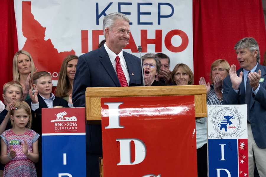 Idaho Gov. Brad Little is cheered by attendees and family after declaring victory in the gubernatorial primary during the Republican Party's primary election celebration Tuesday at the Hilton Garden Inn hotel in Boise, Idaho.