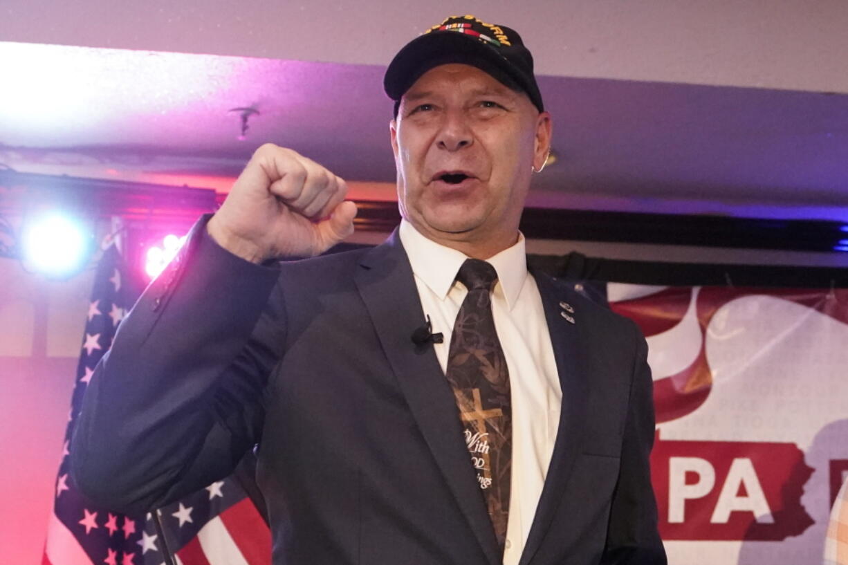 State Sen. Doug Mastriano, R-Franklin, the Republican candidate for Governor of Pennsylvania, gestures to the cheering crowd during his primary night election party in Chambersburg, Pa., Tuesday, May 17, 2022.
