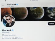 FILE - Part of the Twitter page of Elon Musk is seen on the screen of a computer in Sausalito, Calif., on Monday, April 25, 2022. The Tesla CEO gave the strongest hint yet Monday, May 16, 2022, that he would like to pay less for Twitter than his $44 billion offer made the previous month.