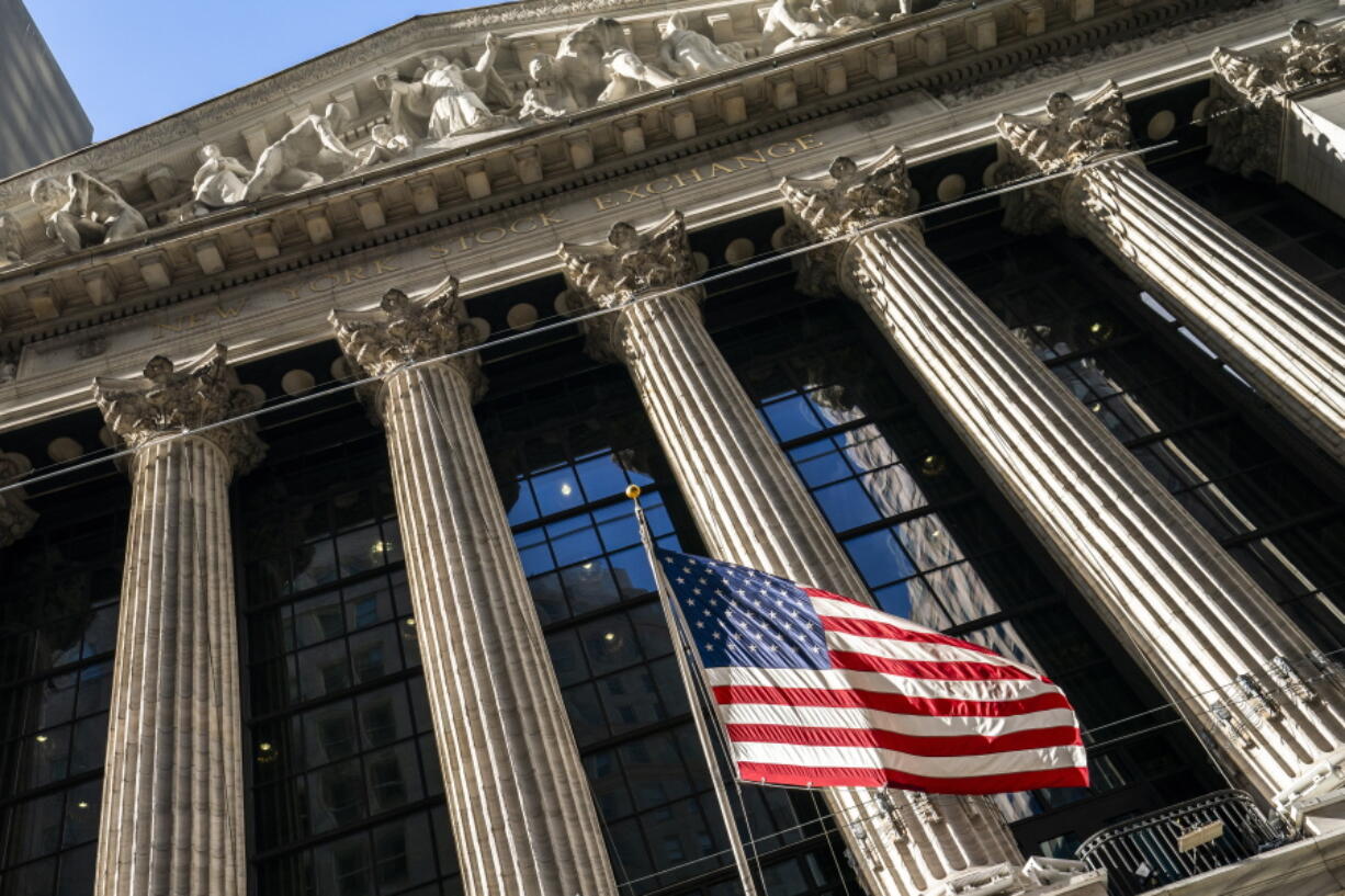 FILE - A U.S. flag waves outside the New York Stock Exchange, Monday, Jan. 24, 2022, in New York.  Stocks were moving between small gains and losses in early trading Wednesday, May 25, on Wall Street, keeping most of the major indexes in the green for the week so far.